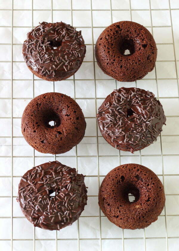 Baked Chocolate Doughnuts Recipe - Soft and fluffy and thickly frosted with a rich mocha ganache, they make getting out of bed worthwhile! | sliceofkitchenlife.com