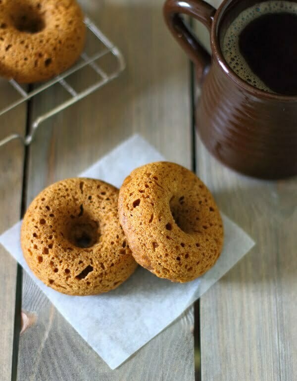 Baked Pumpkin Doughnuts with Salted Maple Caramel Recipe - These soft and fluffy baked pumpkin doughnuts are drizzled with a salted maple caramel for a sticky-sweet breakfast treat!