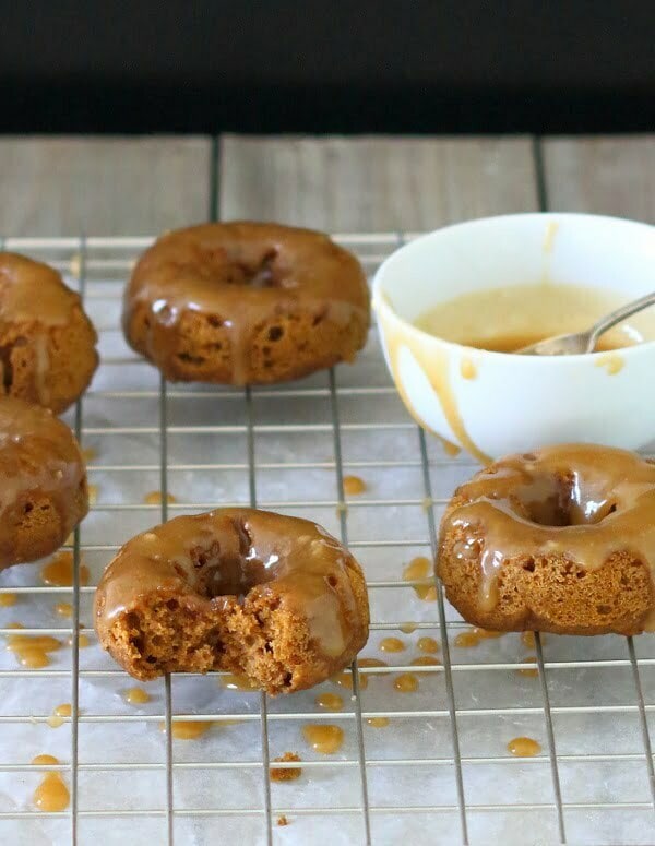Baked Pumpkin Doughnuts with Salted Maple Caramel Recipe - These soft and fluffy baked pumpkin doughnuts are drizzled with a salted maple caramel for a sticky-sweet breakfast treat! | sliceofkitchenlife.com