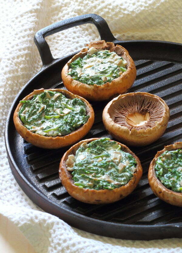 Creamy Spinach Stuffed Mushroom Recipe - Portobello mushrooms stuffed with creamy garlic spinach, then topped with grated parmesan - the perfect summer lunch!