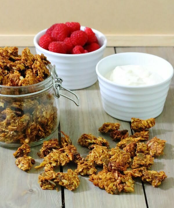 Pumpkin Spice Granola Recipe - Loaded with the flavours of fall and sweetened with honey, these chewy, spicy clusters make a great breakfast parfait.
