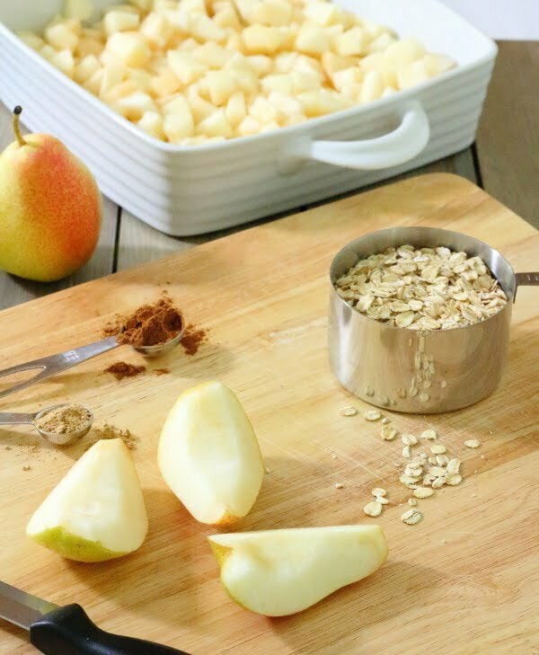 Spiced Pear & Chocolate Crisp Recipe - Pears, chocolate and spices are combined in this tasty fruit crisp, made with whole-grains, coconut oil and maple syrup.